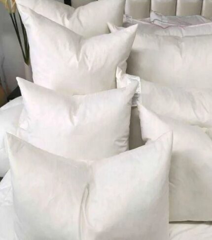 a pile of white pillows