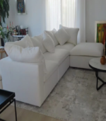 Comfortable white Foam Cloud Modular Sectional Sofa arranged in an L-shape in a bright living room